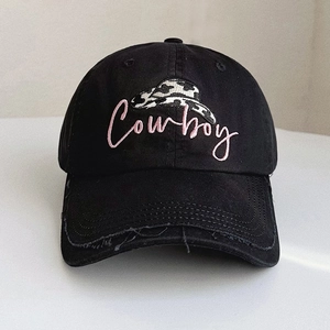Distressed black cotton baseball cap with pink Cowboy embroidery and denim hat motif