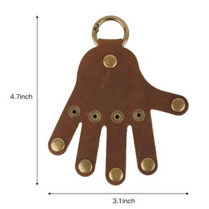Brown vintage leather palm keychain with bronze metal rivets and dimensions shown