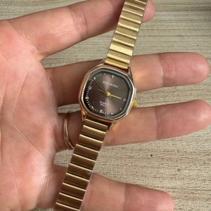 Elegant gold metal square dial watch for women with brown face and quartz movement