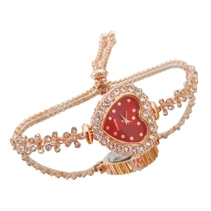 Rose gold heart-shaped watch with red dial and crystal rhinestones on white background