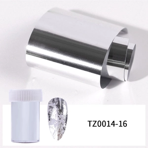 Detail of silver metallic nail art foil roll and plastic storage container for DIY decor