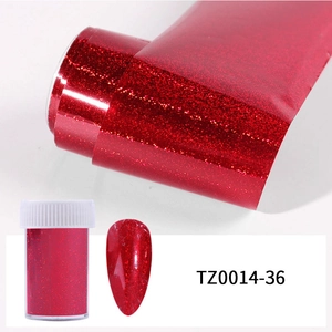 Detail of red glitter nail art foil roll and sample showing shiny metallic effect