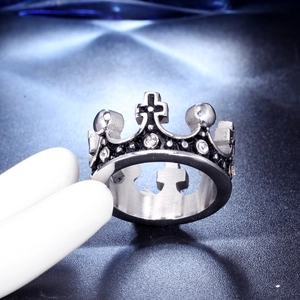 Macro detail of a vintage crown ring with cross motifs and small sparkling crystals