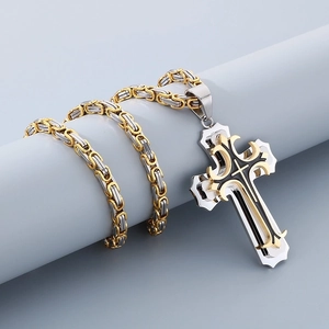 Detail of a two-tone Byzantine chain and multilayer stainless steel cross pendant