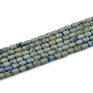 Macro detail of cylindrical geode agate barrel beads with natural mineral texture