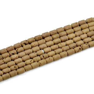 Macro detail of cylindrical geode agate beads with vintage brown matte mineral texture