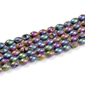 Macro detail of iridescent geode agate beads with metallic aurora plating for DIY jewelry