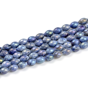 Detailed view of iridescent blue oval geode agate beads with polished metallic finish