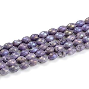 Close-up of purple druzy agate oval beads with iridescent metallic luster for DIY jewelry