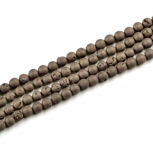 Macro view of 10mm matte bronze lava stone round beads for jewelry making