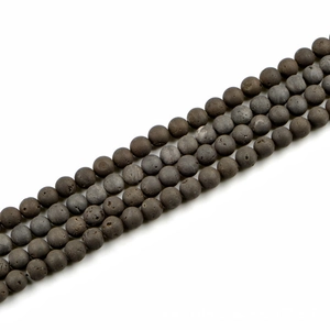 Detailed macro view of 10mm matte natural stone beads with fine porous texture for DIY