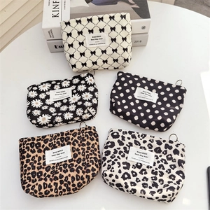 Portable corduroy cosmetic pouches in five patterns including leopard and floral prints