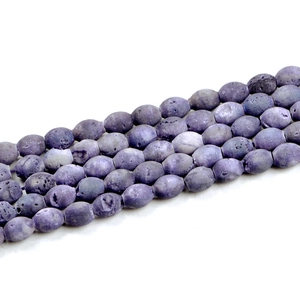Macro shot of purple oval geode agate beads showing natural lava textures for DIY jewelry