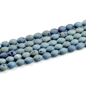 Macro view of oval blue-grey druzy agate natural stone beads for DIY jewelry making