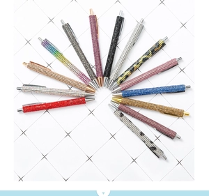 Detailed fan arrangement of colorful crystal-encrusted metal ballpoint pens for business