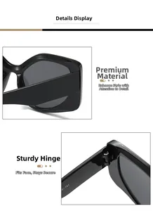 Close-up of black oversized sunglasses showing metallic hinges and polished frame texture