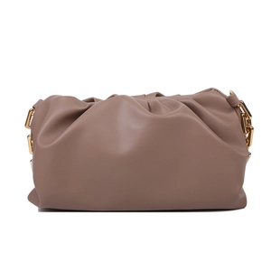 Detailed view of soft pleated cloud bag in dusty pink leather with gold hardware accents