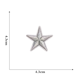 Macro shot of silver star embroidery patch with 4.3cm size markers on white background
