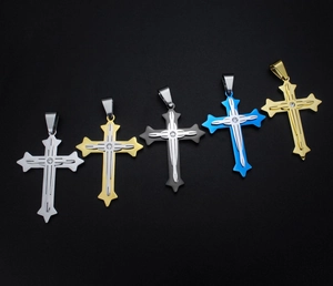 Macro shot of stainless steel cross pendants in five colors with centered diamond inlay