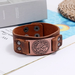 Close-up of brown leather Viking Tree of Life bracelet with bronze pentagram charm