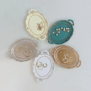 Retro resin jewelry trays in beige, teal, silver, white and gold for ring display