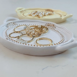 European vintage resin jewelry tray set in white and yellow with golden embossed edges