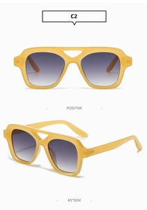 Macro detail of translucent yellow square aviator sunglasses with purple gradient lenses