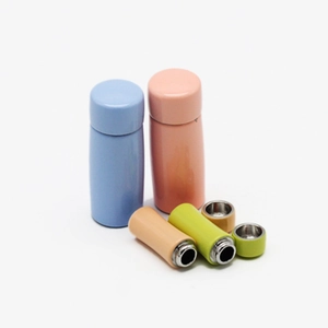 Detail view of 1:12 dollhouse miniature colorful vacuum flasks with removable lids