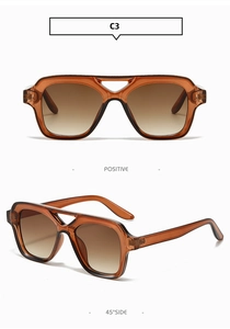 Detail of square pilot sunglasses with double bridge and amber plastic frames