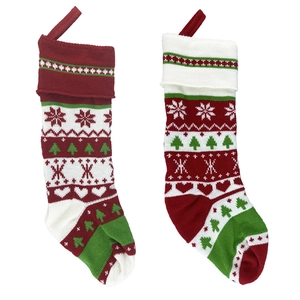 Knitted Christmas stockings with red, white, and green snowflake patterns and hanging loops