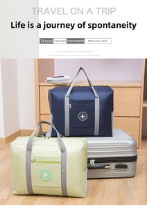 Foldable large capacity travel bag with luggage sleeve and front pocket in navy and green