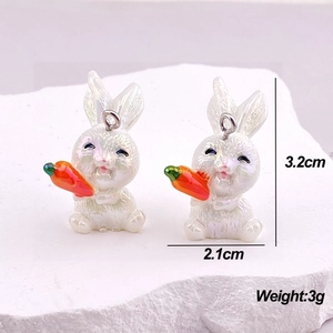Macro shot of 3.2cm pearlescent white rabbit charms with size and weight measurements
