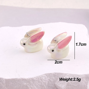 Detail view of pearl white resin rabbit pendant with dimensions 1.7cm by 2cm and weight
