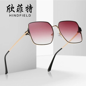 Detail shot of large square gradient purple lenses and thin golden metal frame sunglasses