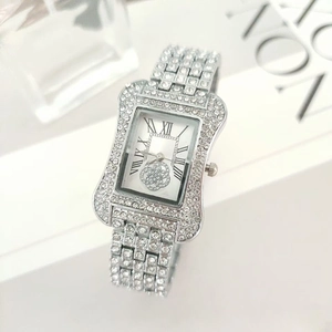 Sparkling silver rhinestone-encrusted tonneau watch with Roman numerals and flower dial