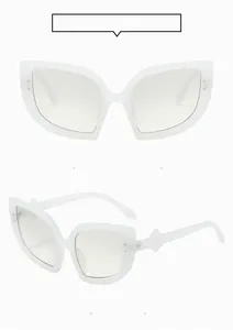 Front and 45-degree side view of white cat-eye sunglasses with silver dot accents