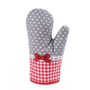 Detailed view of pastoral cotton oven mitt with red plaid, polka dots and bow accent