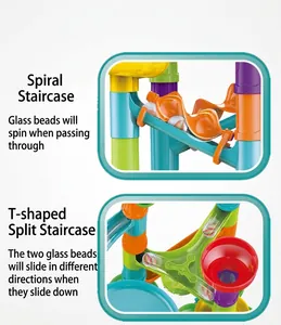 Detail of colorful marble run tracks showing spiral elevators and T-junction slide pieces