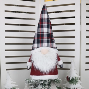 Christmas tree topper gnome with a black and red plaid hat and long white beard decoration