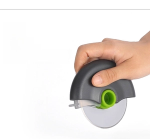 Ergonomic handheld pizza cutter wheel with non-slip green handle and sharp stainless steel blade