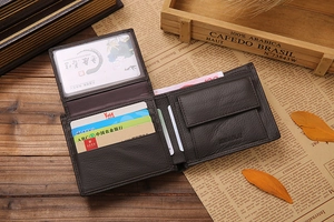 Detail view of deep brown leather bifold wallet showing multiple card slots and texture
