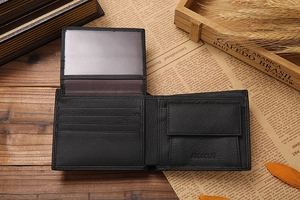 Interior detail of men's short leather trifold wallet with card slots and coin pocket