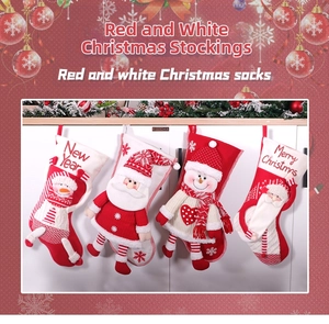 Detail of red and white Christmas stockings featuring plush 3D Santa and Snowman embroidery