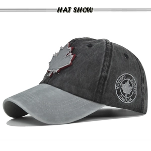 Side view of washed cotton baseball cap featuring vintage maple leaf embroidery detail
