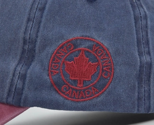 Close-up of Canada maple leaf embroidery on washed cotton canvas baseball cap side