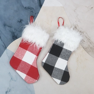 Plaid Christmas stockings with faux fur trim in red and black checkered patterns