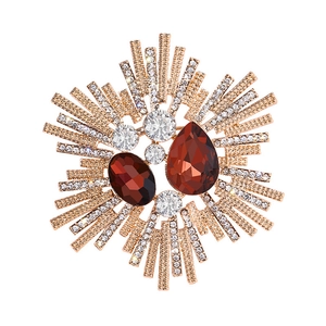 Vintage gold-plated floral brooch with amber gemstones and sparkling rhinestones
