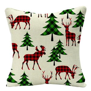 Detail of Christmas linen pillowcase with red buffalo plaid reindeer and green pine tree