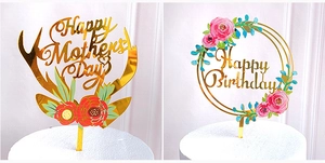 Golden acrylic cake toppers with floral print for Mother's Day and Birthday celebrations