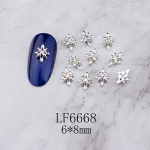 Detail of silver octagonal star nail charms with aurora rhinestones, size 6x8mm